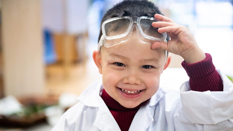 Preschool child with safety glasses